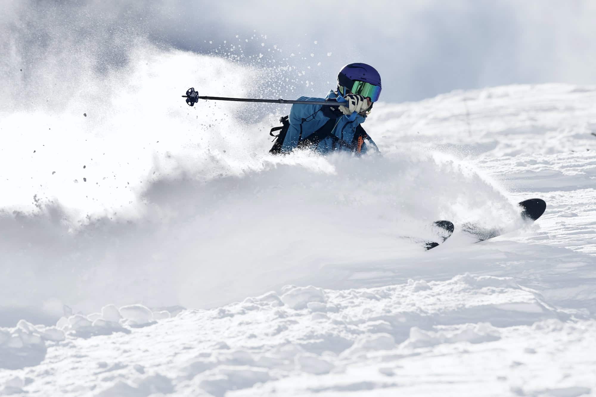 Male skier swerve skiing down mountain, Alpe-d'Huez, Rhone-Alpes, France